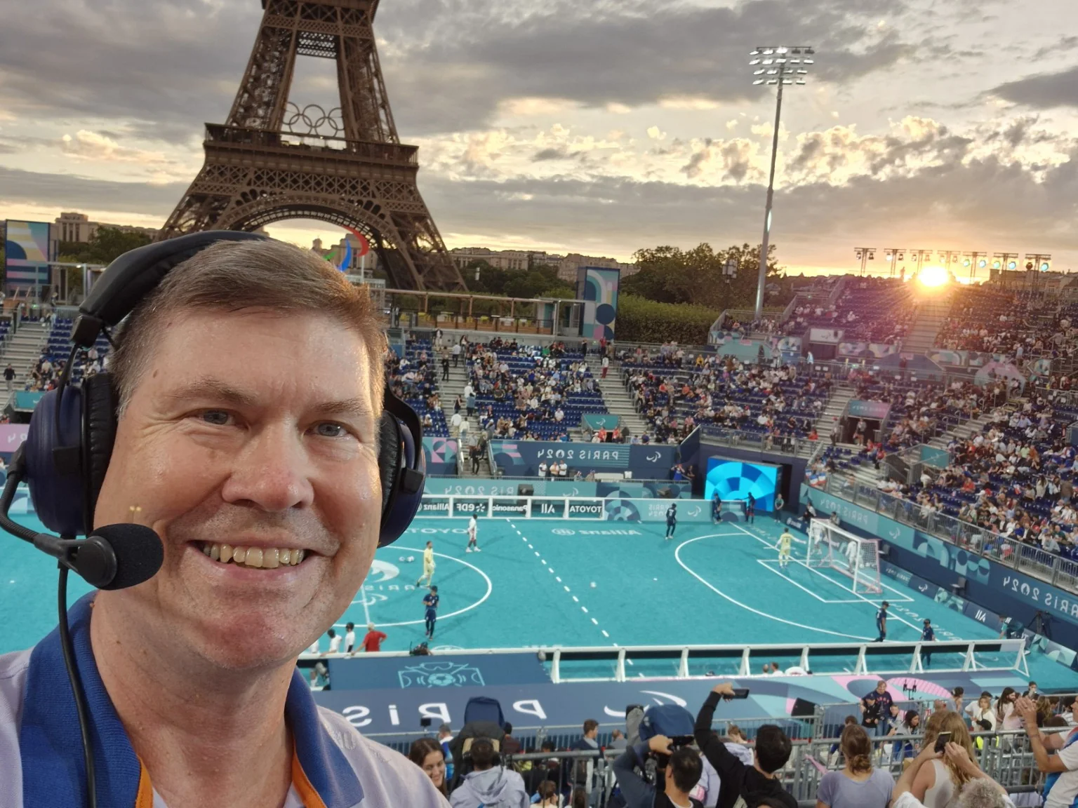 Hans Frauenlob at the Paris 2024 blind football final with the Eiffel Tower visible behind the venue.